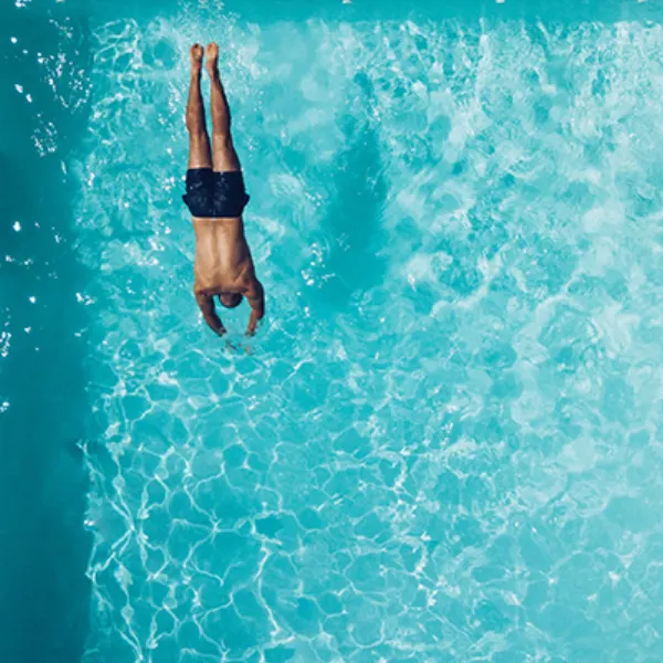 Swimmer diving in a pool