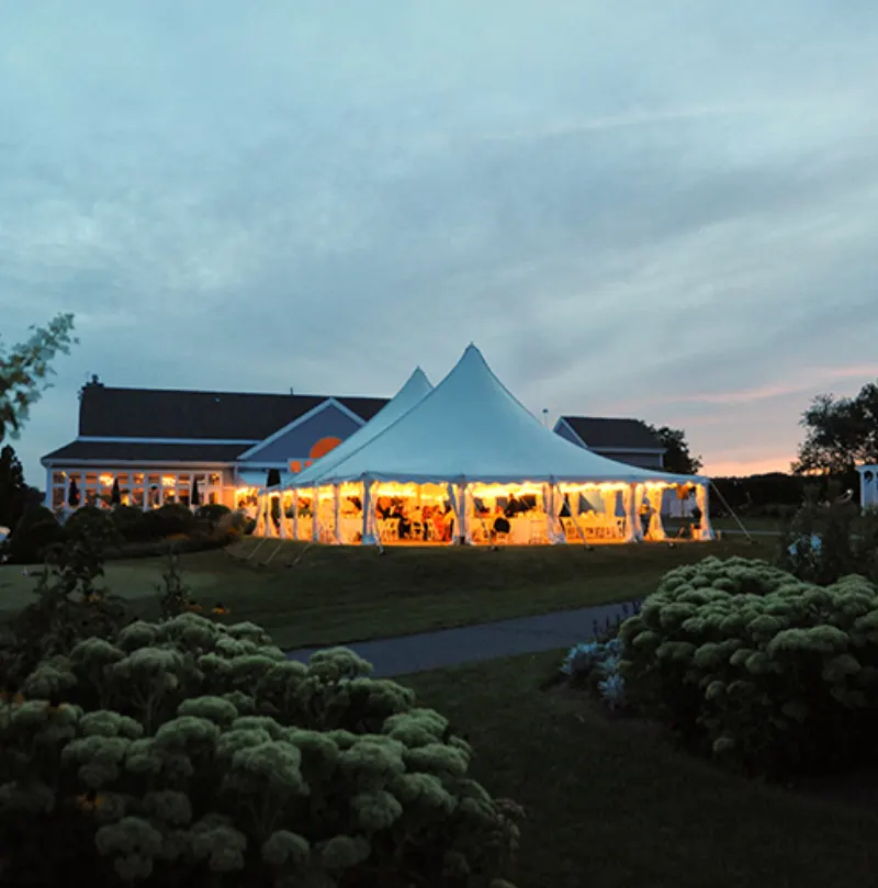 The tent glowing at dusk